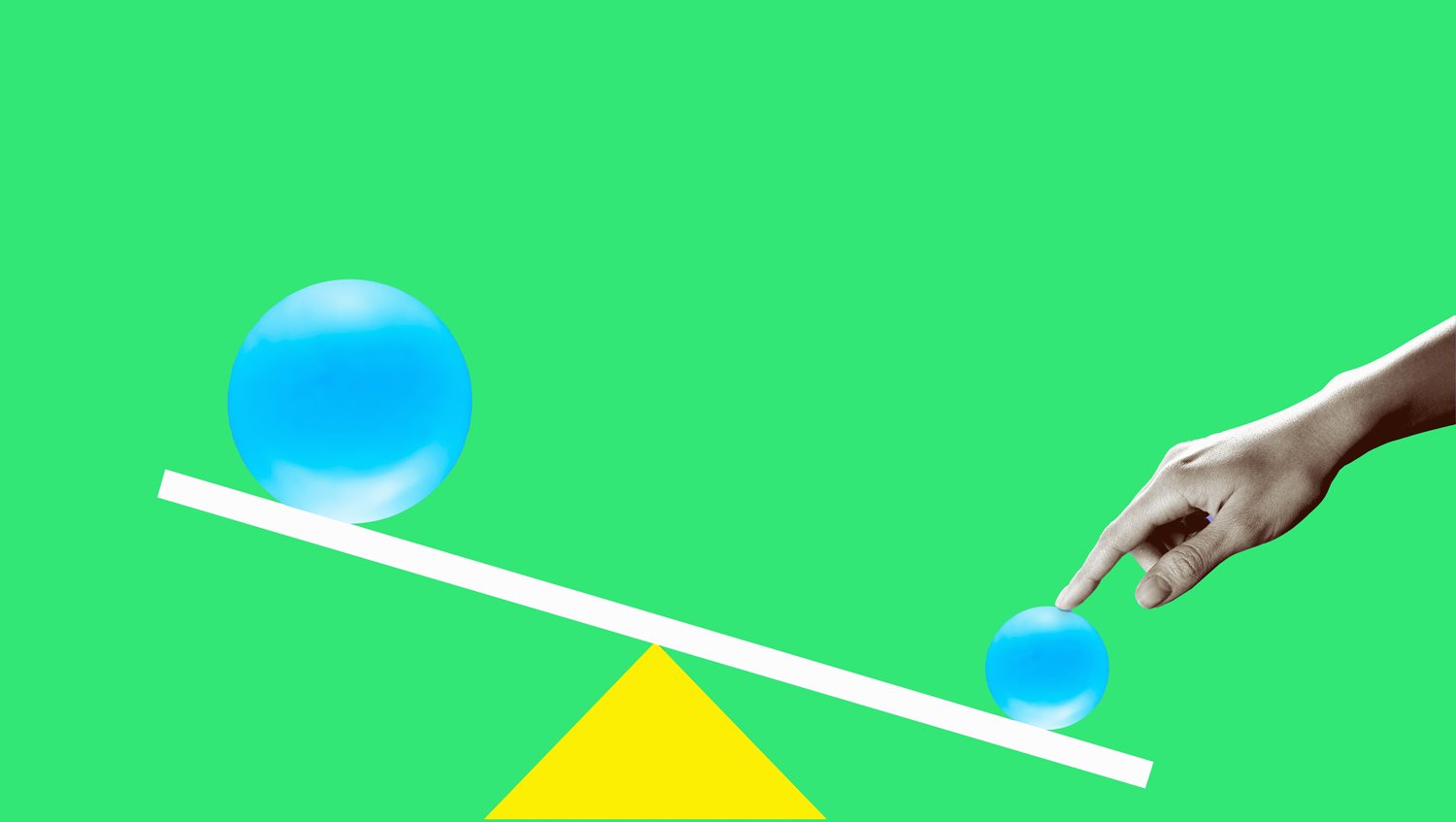 Hand holding down a see-saw with blue spheres