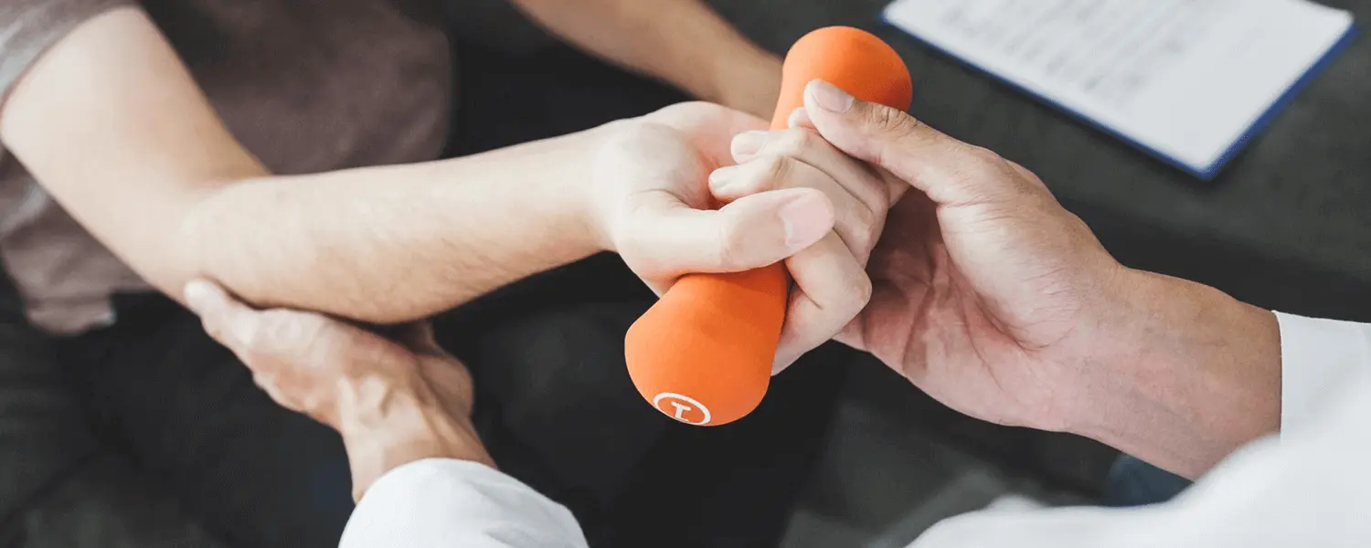 Someone going through rehabilitation with a one pound dumbbell