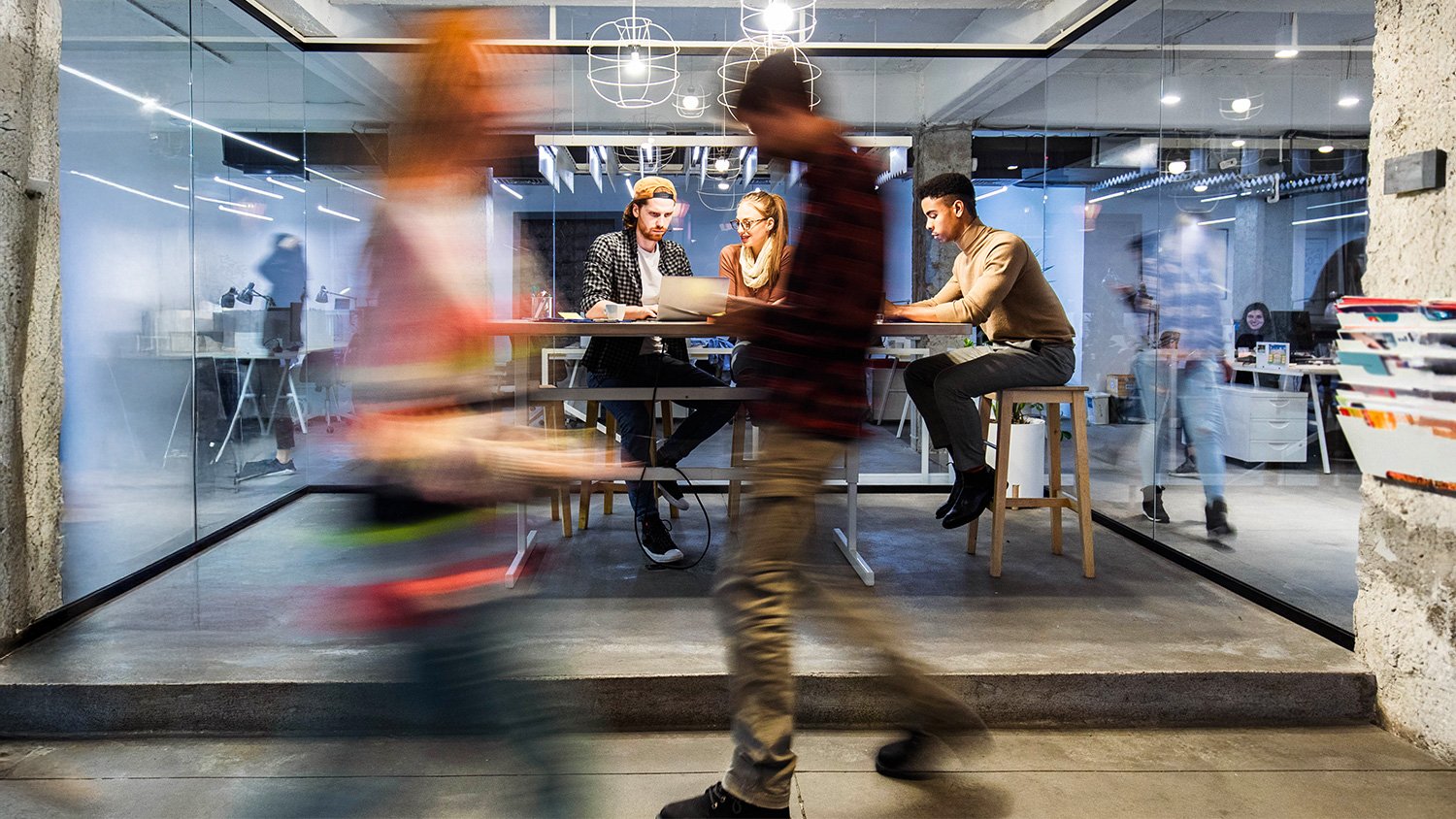 Bustling workplace environment with coworkers collaborating