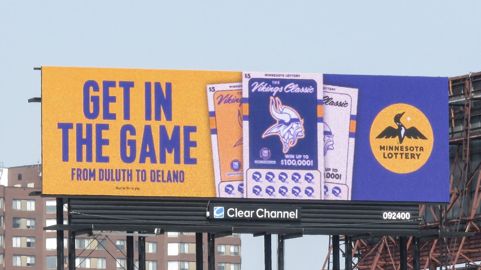 A Billboard showcasing a collaboration between the Minnesota Vikings and the Minnesota State Lottery. The text reads: "Get in the Game"